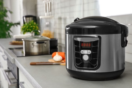 modern electric pressure cooker on kitchen table