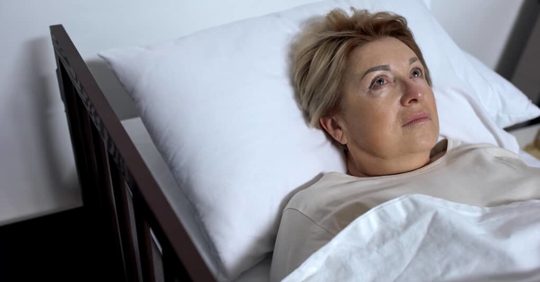 a woman in a hospital bed